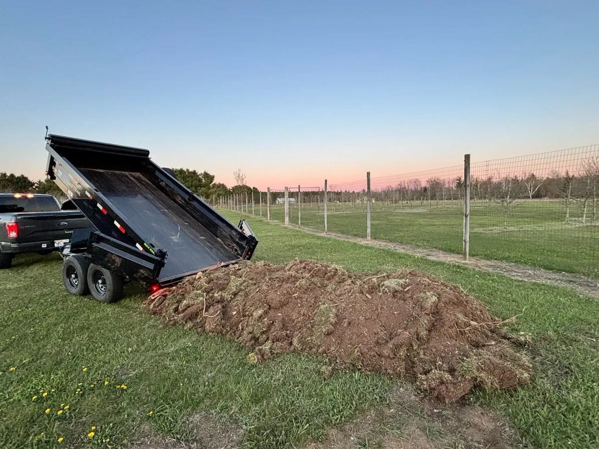 Our 6x12' dump trailer dumping fill/dirt.