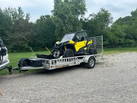Our 14' utility trailer hauling a SXS