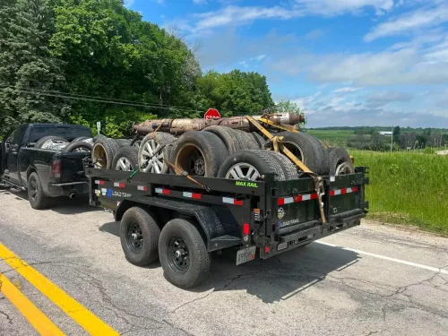 Our 6x12' dump trailer picking up scrap