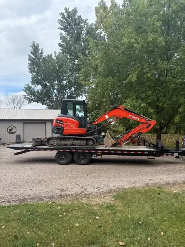 Kabota mini excavator on our 24ft deckover tilt trailer