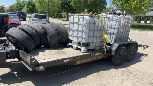 Totes and tires on our 20ft flatbed trailer