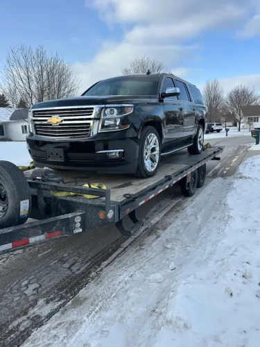 Chevrolet suburban on our 24 foot deck over tilt trailer