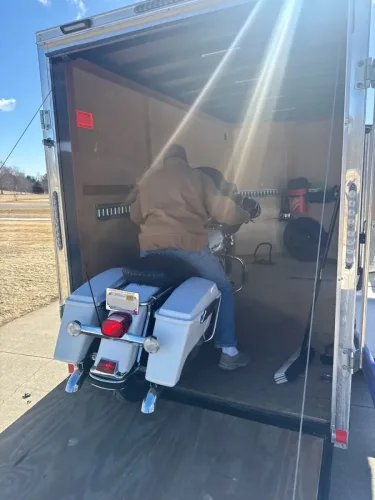 Harley in our 6x12' enclosed trailer with motorcycle wheel chock