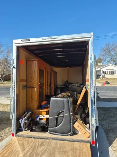Moving personal belongings with her 6 x 12 enclosed cargo trailer