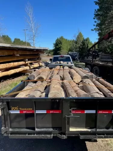 Logs transported with 7x14' dump trailer