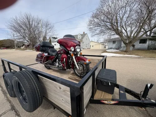 Harley Davidson motorcycle in our 12' utility trailer with motorcycle wheel chock