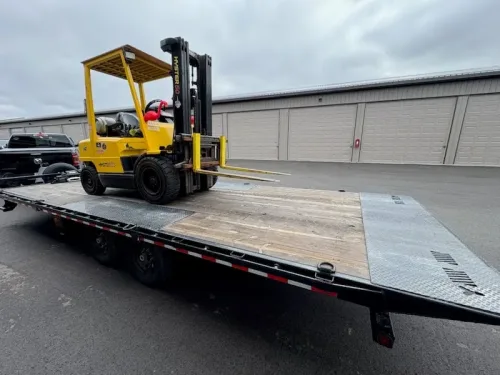 Hyster forklift on our 24ft deckover tilt trailer