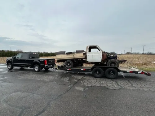 Truck and parts on our 20ft 12k flatbed trailer