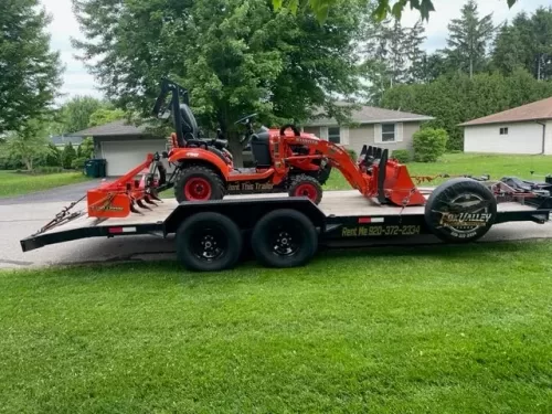 Kubota tractor on 20ft car hauler trailer