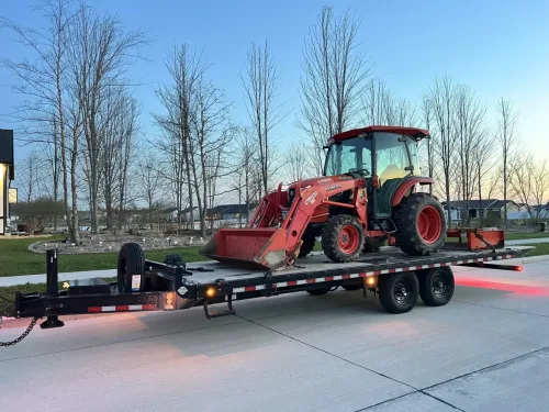 Kabota tractor on our 24ft deckover tilt trailer