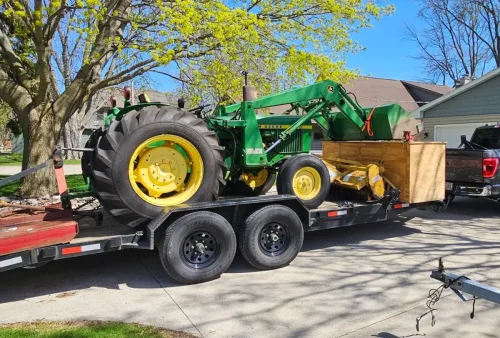 John Deere tractor on our 20ft 12k flatbed trailer