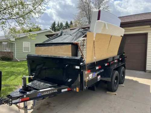 Our 6x12' dump trailer hauling household junk