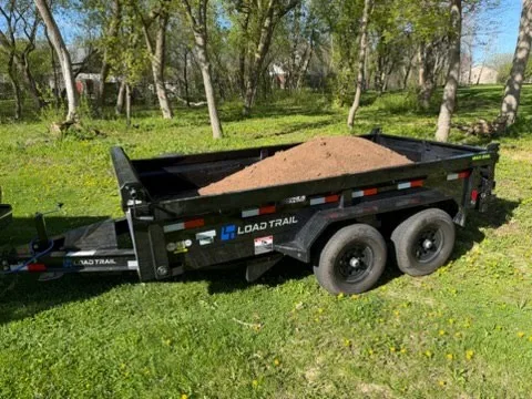 Our 6x12' dump trailer hauling topsoil