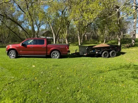 Our 6x12' dump trailer hauling topsoil with a 1/2-ton truck