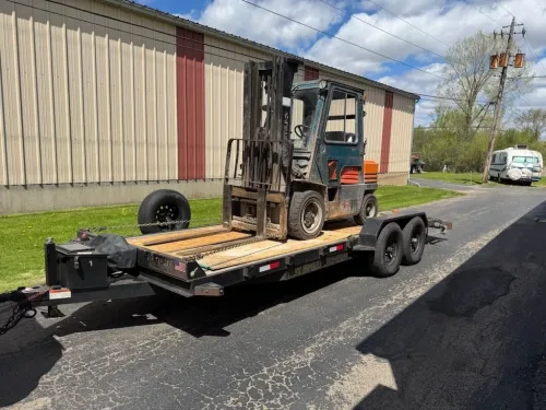 10K forklift on our 20ft 12K flatbed trailer