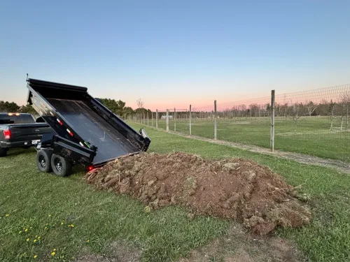 Our 6x12' dump trailer dumping fill/dirt.