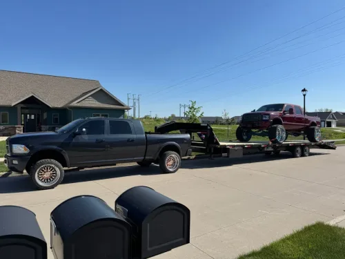 Our 36ft gooseneck trailer transporting a lifted, modified Ford F350