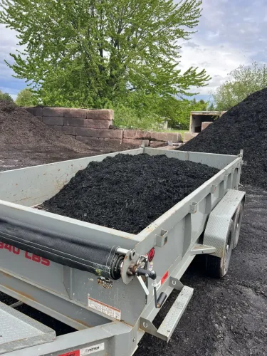 Our 7x14' dump trailer picking up mulch