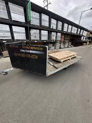 Pallets on 2-place snowmobile trailer