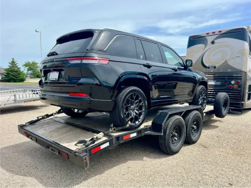 Our 20ft flatbed trailer hauling a new Jeep