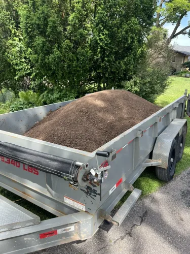 Our 7x14' dump trailer hauling top soil