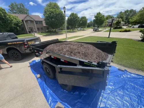 Our 6x12' dump trailer hauling mulch