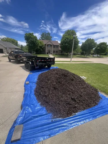 Our 6x12' dump trailer dumping mulch