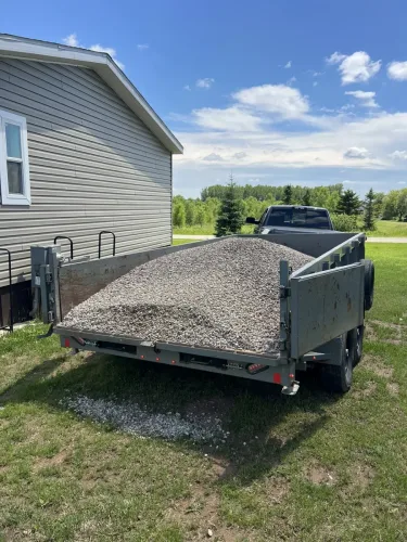 Our 7x14' dump trailer hauling 3/4 river rock