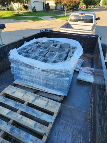 Our 7x14' dump trailer hauling paver bricks