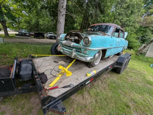 Our 20ft flatbed trailer hauling a vintage project car