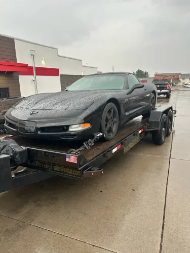 Our 20ft flatbed trailer hauling a Corvette