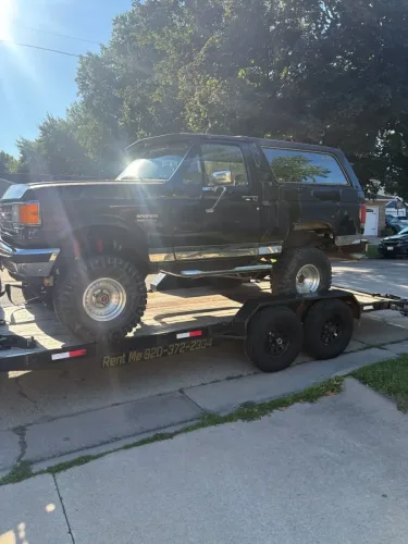 Our 20ft flatbed trailer hauling a Ford Bronco