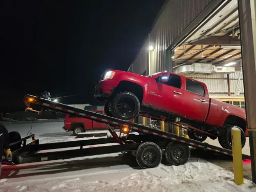 Chevy truck on our 24 foot deck over tilt trailer