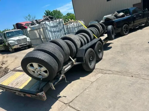 Totes and tires on our 20ft flatbed trailer