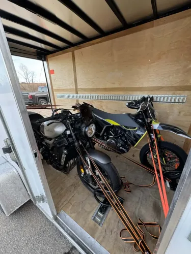 Two motorcycles in our 6x12’ enclosed trailer with motorcycle wheel chicks
