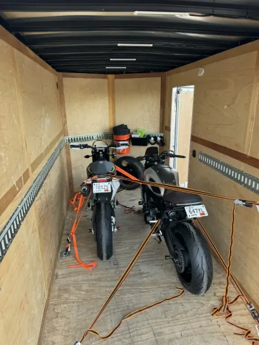Two motorcycles in our 6x12’ enclosed trailer with motorcycle wheel chicks