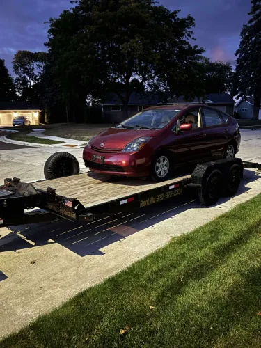 Toyota Prius on our 20ft flatbed trailer