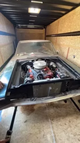 Old car in 8.5x20' enclosed trailer